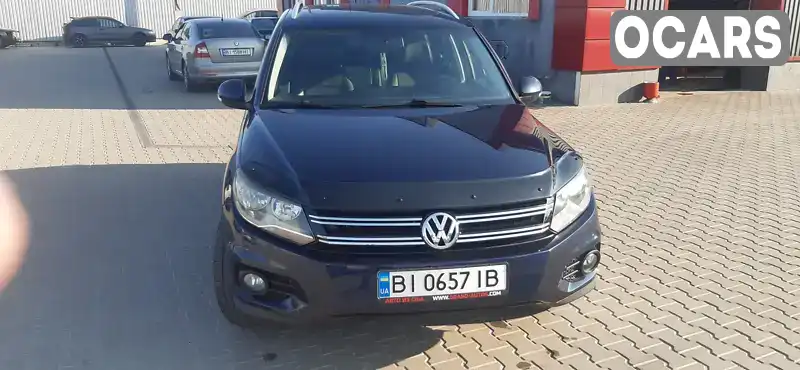 Внедорожник / Кроссовер Volkswagen Tiguan 2014 2 л. Автомат обл. Полтавская, Лубны - Фото 1/12