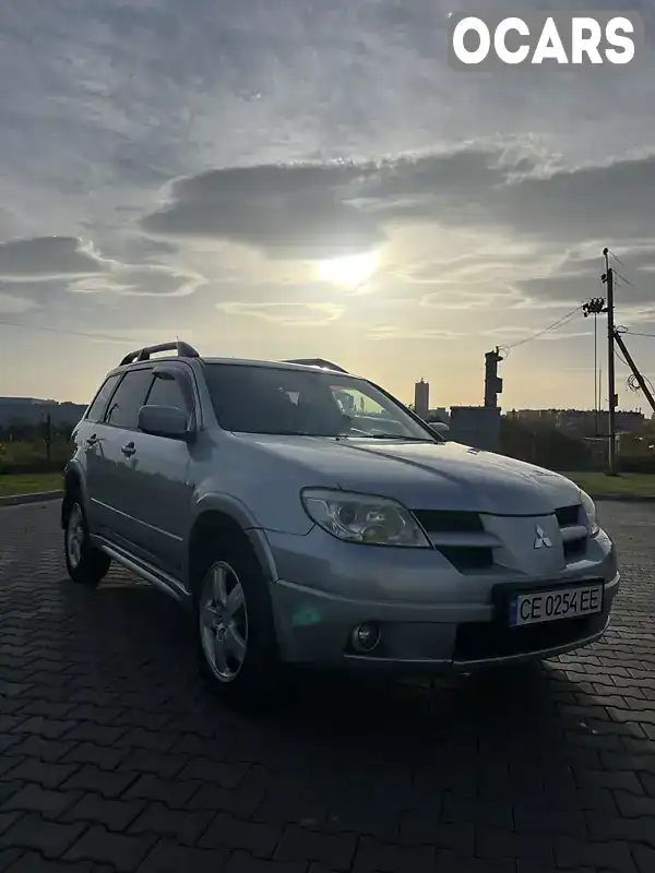 Внедорожник / Кроссовер Mitsubishi Outlander 2008 2.38 л. Автомат обл. Черновицкая, Черновцы - Фото 1/10