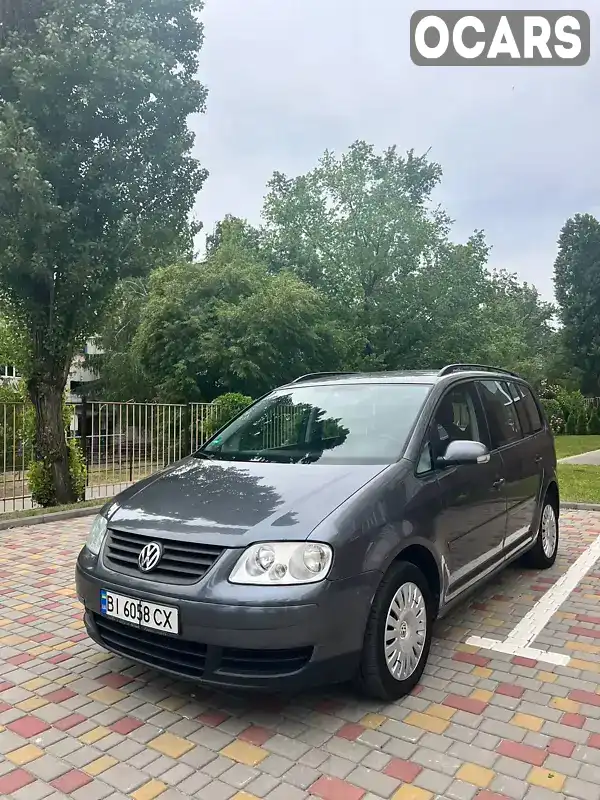 Минивэн Volkswagen Touran 2005 1.9 л. Автомат обл. Полтавская, Кременчуг - Фото 1/21