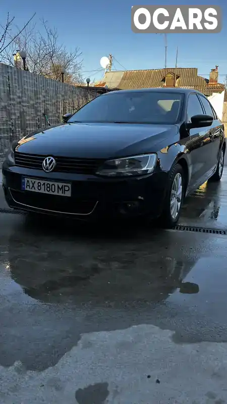 Седан Volkswagen Jetta 2013 1.8 л. Автомат обл. Харківська, Харків - Фото 1/14