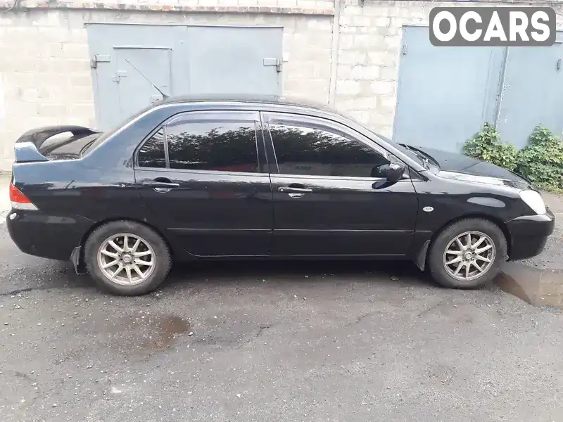 Седан Mitsubishi Lancer 2006 1.59 л. Ручная / Механика обл. Днепропетровская, Днепр (Днепропетровск) - Фото 1/14