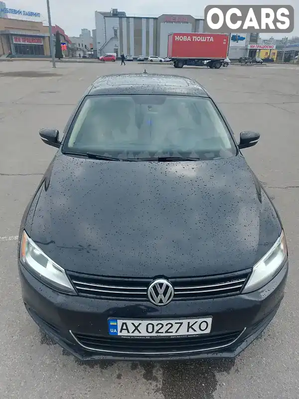 Седан Volkswagen Jetta 2013 2.48 л. Автомат обл. Харківська, Харків - Фото 1/21