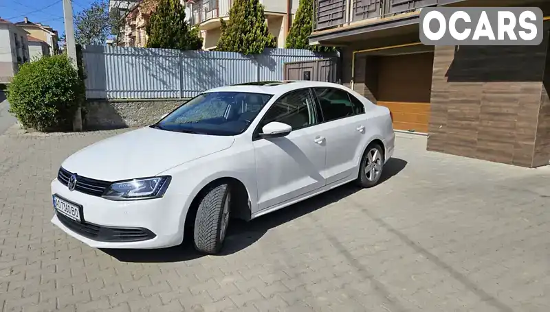 Седан Volkswagen Jetta 2013 1.6 л. Ручная / Механика обл. Закарпатская, Ужгород - Фото 1/21