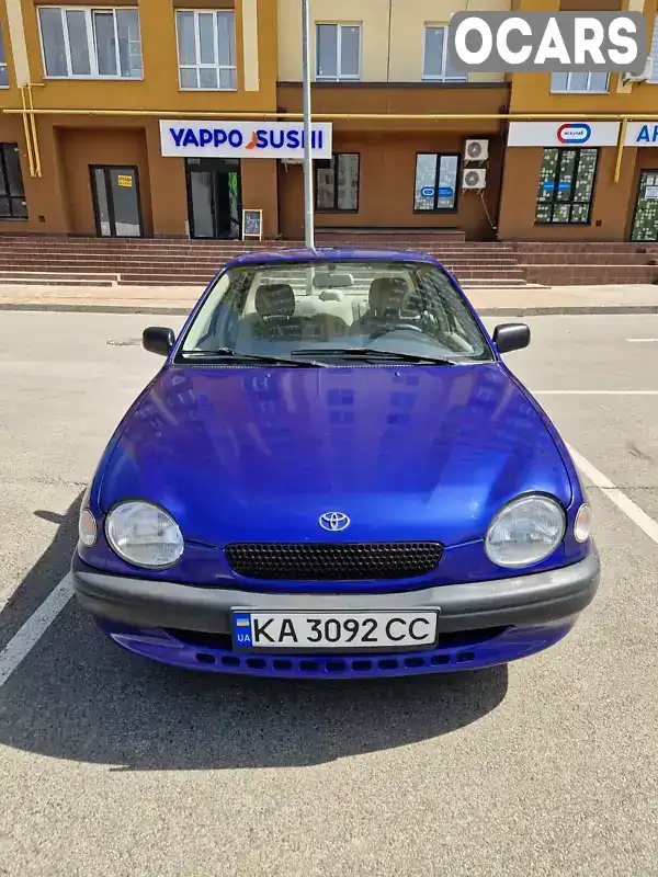 Седан Toyota Corolla 1997 2 л. Автомат обл. Киевская, Вышневое - Фото 1/21