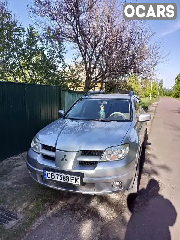 Внедорожник / Кроссовер Mitsubishi Outlander 2009 2.4 л. Автомат обл. Черниговская, Нежин - Фото 1/13