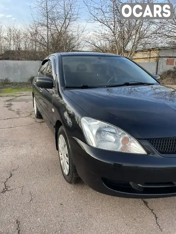 Седан Mitsubishi Lancer 2009 1.58 л. Ручная / Механика обл. Хмельницкая, Хмельницкий - Фото 1/10