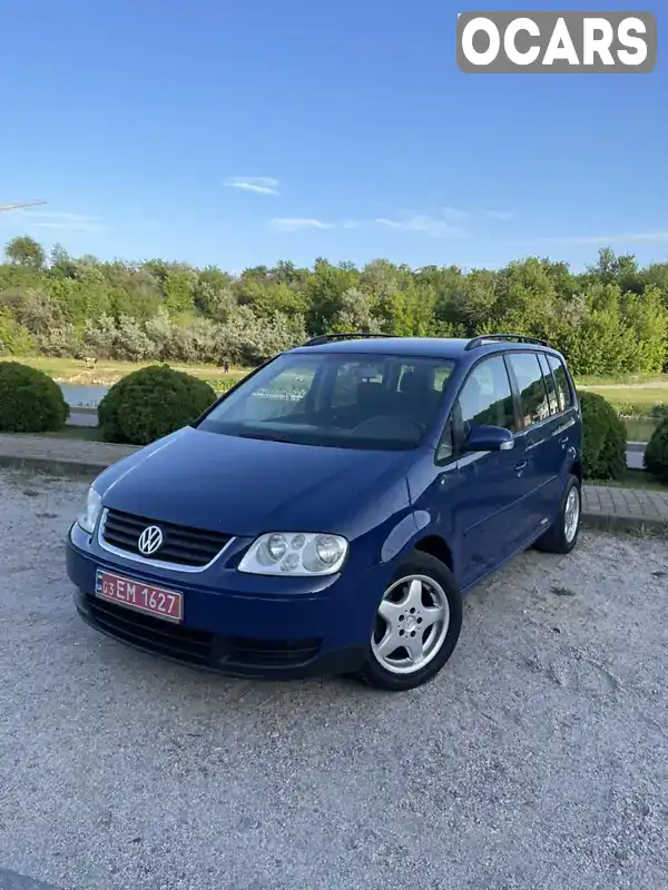 Мінівен Volkswagen Touran 2005 1.6 л. Ручна / Механіка обл. Дніпропетровська, Дніпро (Дніпропетровськ) - Фото 1/21