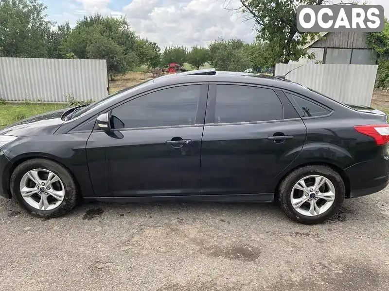 Седан Ford Focus 2014 2 л. Автомат обл. Харківська, Харків - Фото 1/9