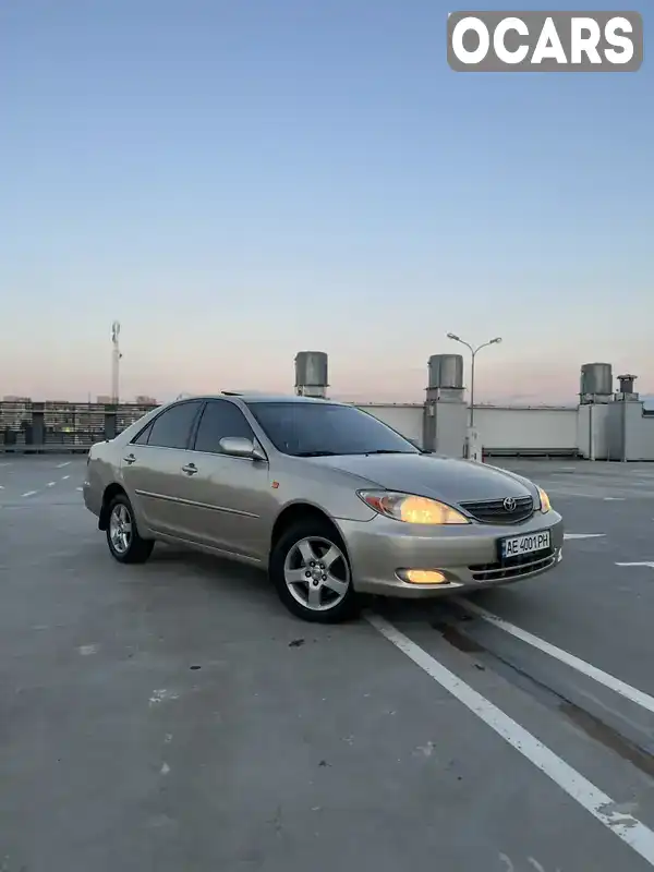 Седан Toyota Camry 2002 3 л. Автомат обл. Київська, Вишневе - Фото 1/21