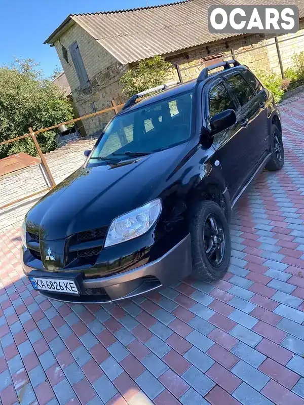 Внедорожник / Кроссовер Mitsubishi Outlander 2004 2.4 л. Автомат обл. Киевская, Киев - Фото 1/21