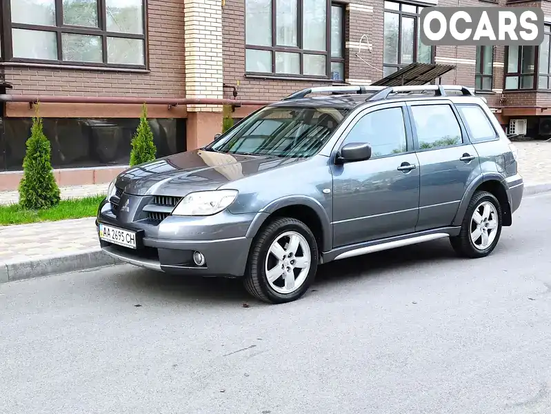 Внедорожник / Кроссовер Mitsubishi Outlander 2009 2.35 л. Автомат обл. Черниговская, Чернигов - Фото 1/19