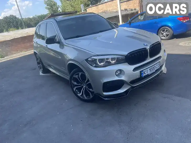 Позашляховик / Кросовер BMW X5 2015 2.98 л. Автомат обл. Київська, Вишневе - Фото 1/12