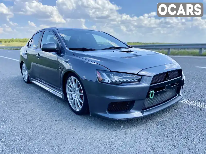 Седан Mitsubishi Lancer Evolution 2013 2 л. Робот обл. Дніпропетровська, Дніпро (Дніпропетровськ) - Фото 1/11