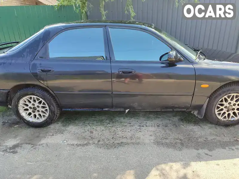 Седан Mazda 626 1995 2 л. Автомат обл. Київська, location.city.stari_petrivtsi - Фото 1/9