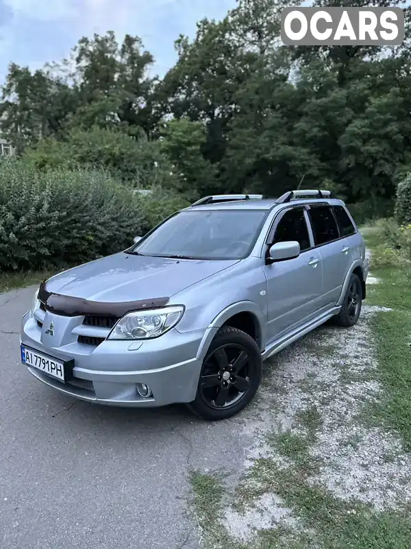 Позашляховик / Кросовер Mitsubishi Outlander 2007 2.38 л. Автомат обл. Київська, Київ - Фото 1/21