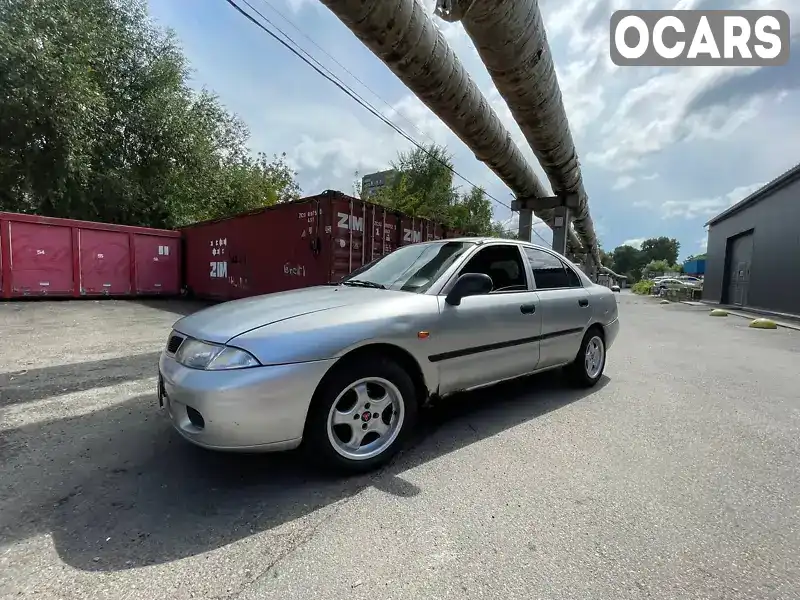 Лифтбек Mitsubishi Carisma 1998 1.6 л. Ручная / Механика обл. Киевская, Киев - Фото 1/21