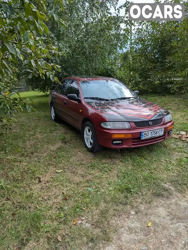 Седан Mazda 323 1996 1.49 л. Ручная / Механика обл. Хмельницкая, Славута - Фото 1/11