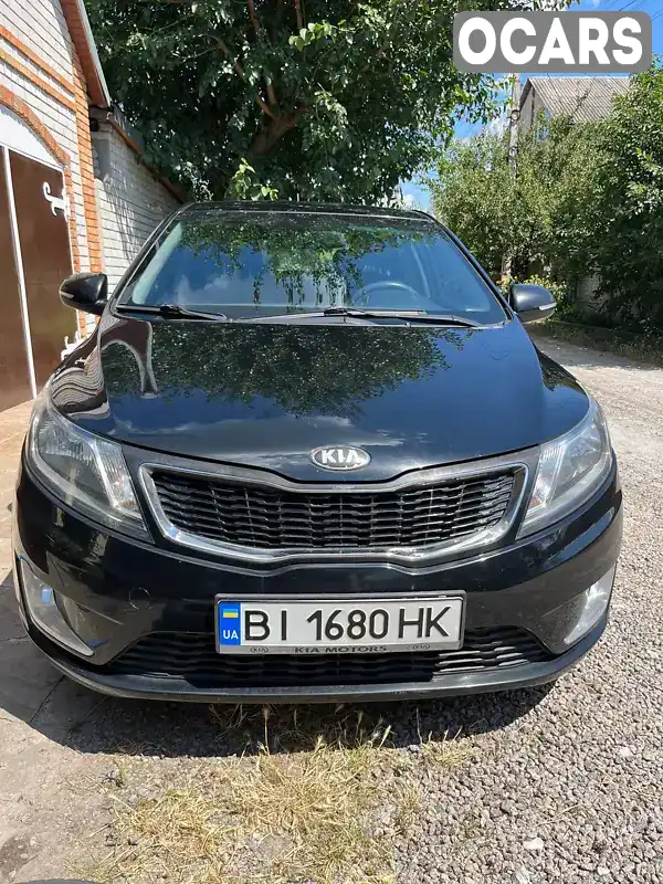 Хетчбек Kia Rio 2013 1.59 л. Автомат обл. Дніпропетровська, Дніпро (Дніпропетровськ) - Фото 1/12