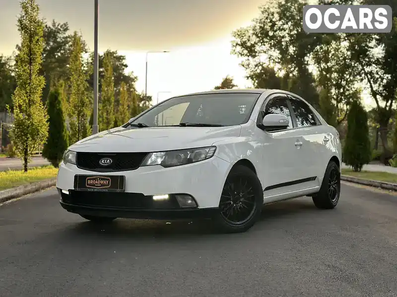 Седан Kia Cerato 2009 1.6 л. Ручна / Механіка обл. Київська, Вишневе - Фото 1/21