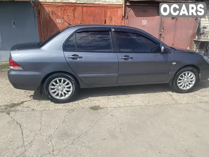 Седан Mitsubishi Lancer 2009 1.6 л. Ручна / Механіка обл. Дніпропетровська, location.city.zelenodolsk - Фото 1/11