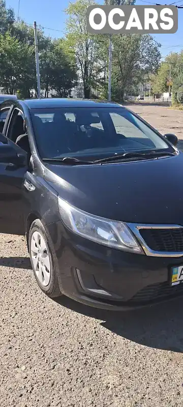 Седан Kia Rio 2013 1.4 л. Автомат обл. Киевская, Киев - Фото 1/9