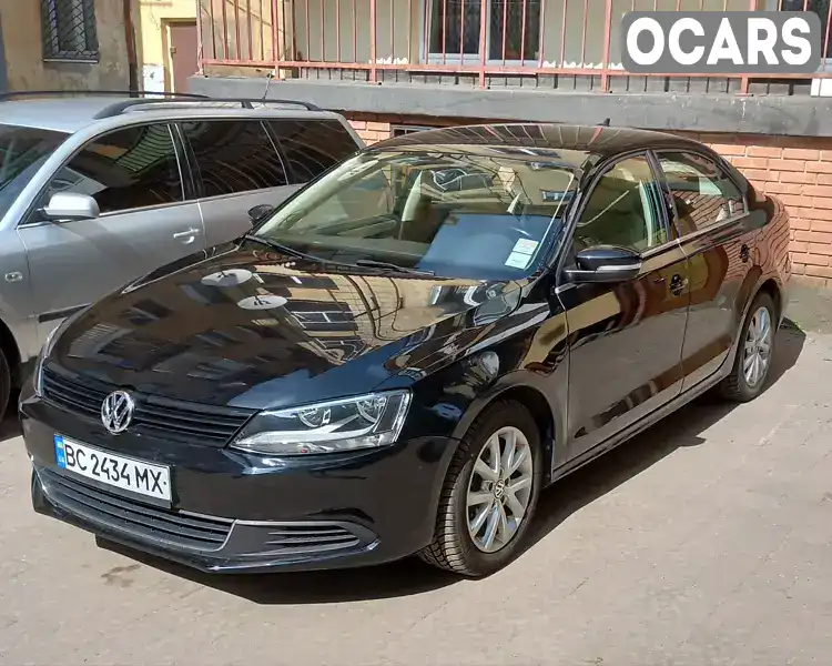 Седан Volkswagen Jetta 2014 1.8 л. Автомат обл. Львівська, Львів - Фото 1/18