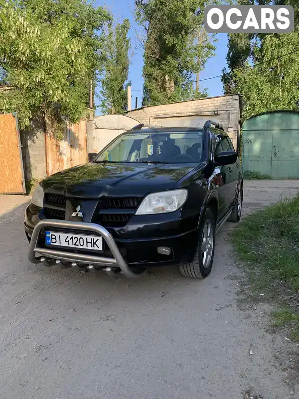 Внедорожник / Кроссовер Mitsubishi Outlander 2006 2.38 л. Автомат обл. Полтавская, Кременчуг - Фото 1/13