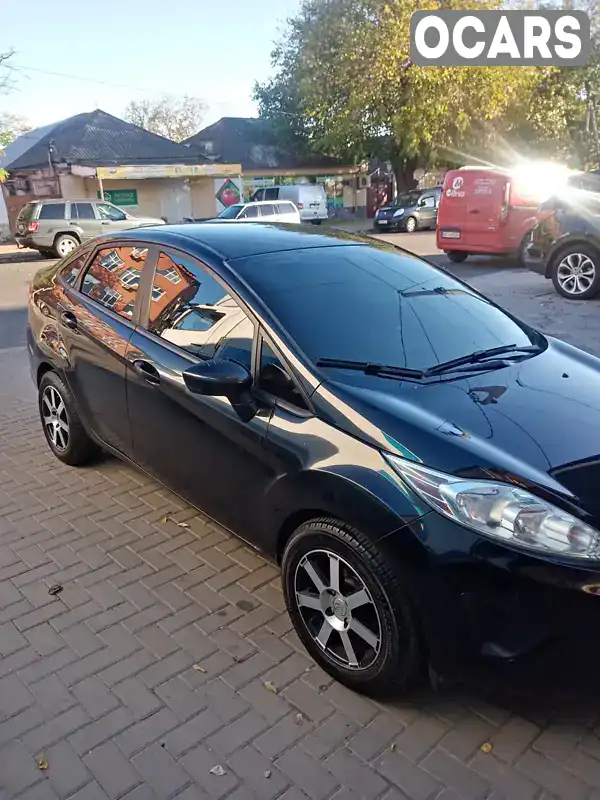 Седан Ford Fiesta 2011 1.6 л. Автомат обл. Миколаївська, Миколаїв - Фото 1/9