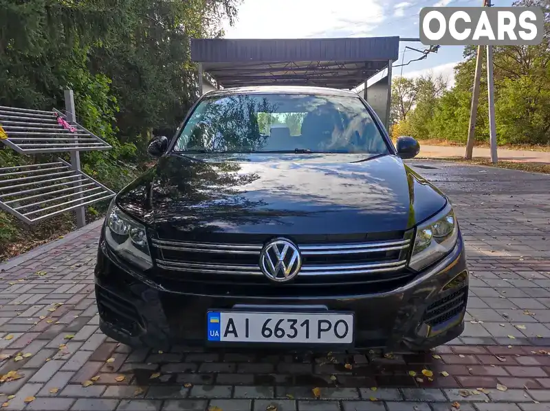 Позашляховик / Кросовер Volkswagen Tiguan 2011 1.98 л. Автомат обл. Київська, Вишневе - Фото 1/21